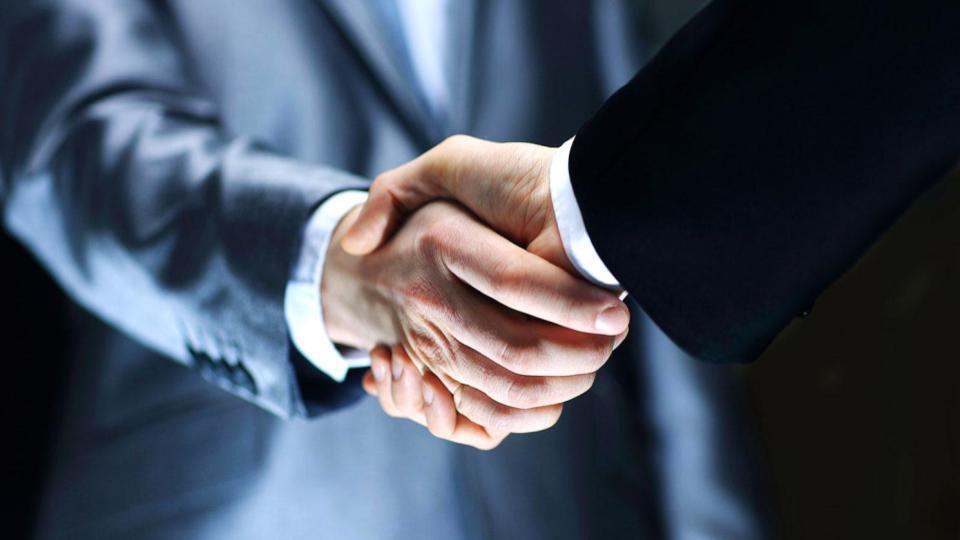 Professional handshake – partnership and trust at Asia Manila Prime Properties